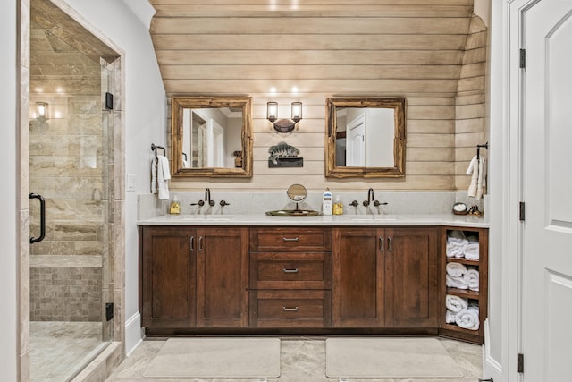 bathroom with a shower with door and vanity