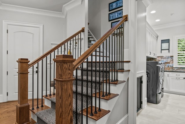 staircase with hardwood / wood-style flooring and ornamental molding