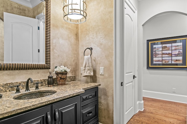 bathroom featuring vanity and hardwood / wood-style floors