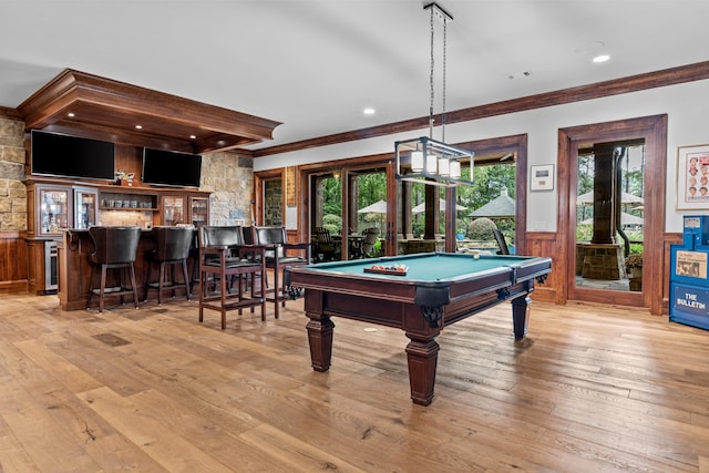 playroom featuring indoor bar, wine cooler, ornamental molding, pool table, and light hardwood / wood-style floors