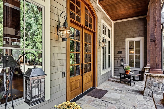 entrance to property featuring a porch