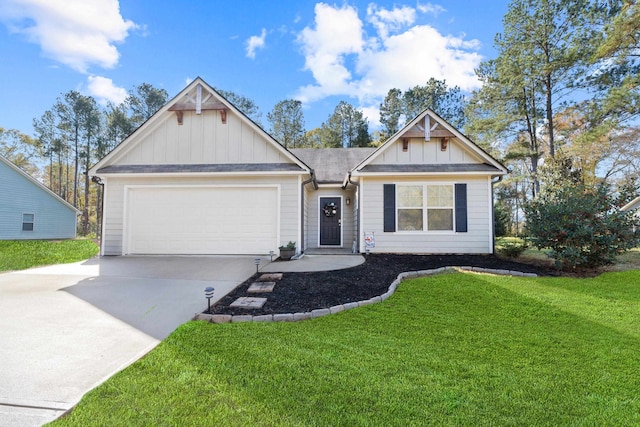 view of front of property featuring a garage and a front lawn