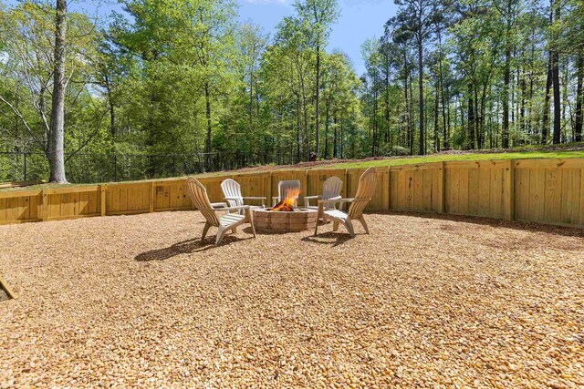 348 Bluegill Rd, Eatonton, GA 31024 - exterior space featuring fence and an outdoor fire pit
