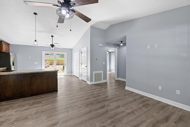 348 Bluegill Rd, Eatonton, GA 31024 - interior space with visible vents, stainless steel refrigerator with ice dispenser, dark wood-style flooring, open floor plan, and ceiling fan