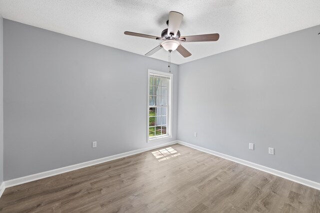 348 Bluegill Rd, Eatonton, GA 31024 - unfurnished room with a textured ceiling, wood finished floors, ceiling fan, and baseboards
