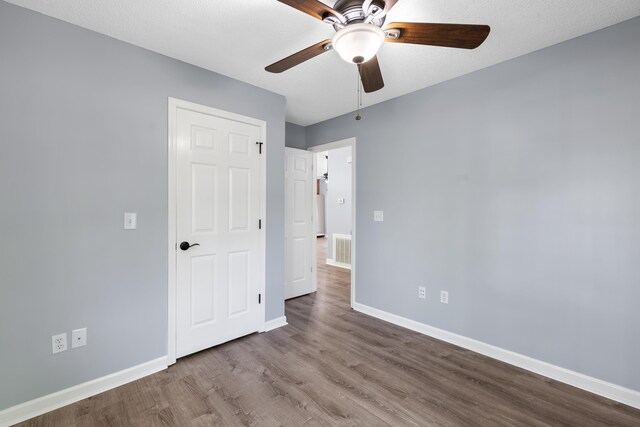 348 Bluegill Rd, Eatonton, GA 31024 - unfurnished bedroom with visible vents, baseboards, a ceiling fan, and wood finished floors