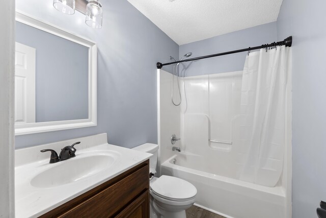 348 Bluegill Rd, Eatonton, GA 31024 - full bathroom with toilet, shower / tub combo with curtain, vanity, and a textured ceiling