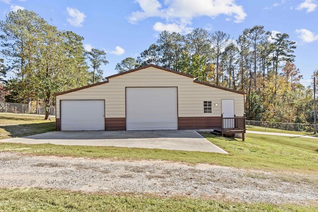 garage featuring a yard