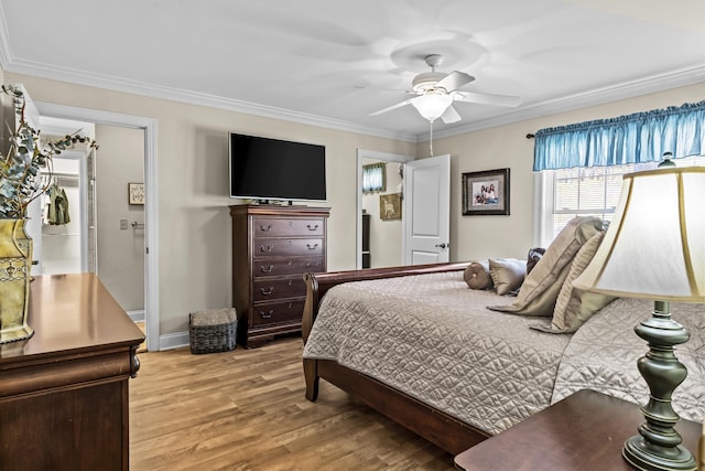 bedroom with ornamental molding, light hardwood / wood-style floors, and ceiling fan