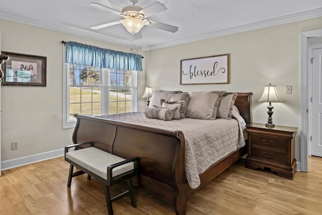 bedroom with ornamental molding, ceiling fan, and light hardwood / wood-style flooring