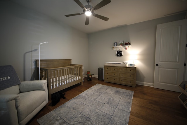 1060 Legend Dr, Greensboro, GA 30642 - bedroom featuring dark wood-style flooring, a crib, and ceiling fan