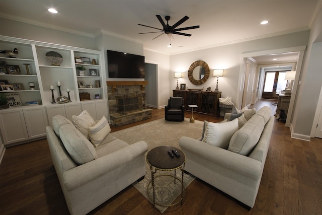 1060 Legend Dr, Greensboro, GA 30642 - living area with ceiling fan, ornamental molding, a stone fireplace, dark wood finished floors, and recessed lighting