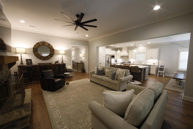 1060 Legend Dr, Greensboro, GA 30642 - living room with ceiling fan, crown molding, dark wood-type flooring, and recessed lighting