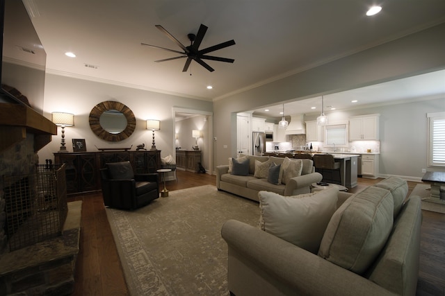 1060 Legend Dr, Greensboro, GA 30642 - living area with a ceiling fan, dark wood-style floors, recessed lighting, and crown molding