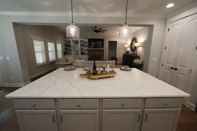 1060 Legend Dr, Greensboro, GA 30642 - kitchen featuring gray cabinetry, open floor plan, ceiling fan, crown molding, and a center island