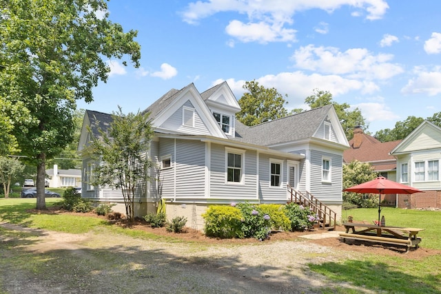 406 Madison Ave, Eatonton, GA 31024 - back of house featuring a yard