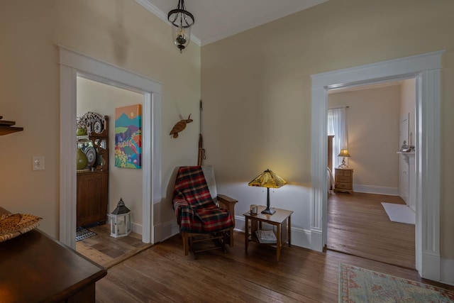 406 Madison Ave, Eatonton, GA 31024 - living area featuring wood finished floors, crown molding, and baseboards