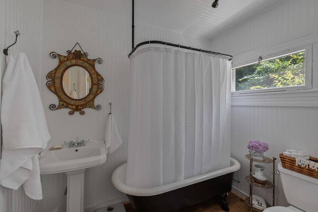406 Madison Ave, Eatonton, GA 31024 - bathroom with toilet and wood finished floors