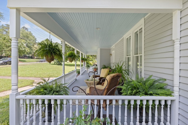 406 Madison Ave, Eatonton, GA 31024 - covered porch featuring a yard