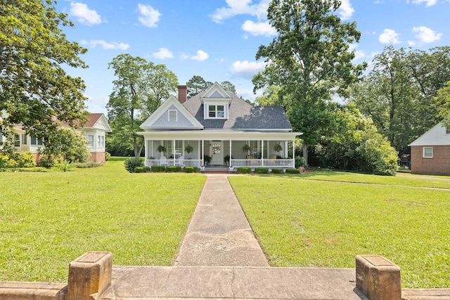 406 Madison Ave, Eatonton, GA 31024 - view of front of house with a porch, a front yard, a chimney, and roof with shingles