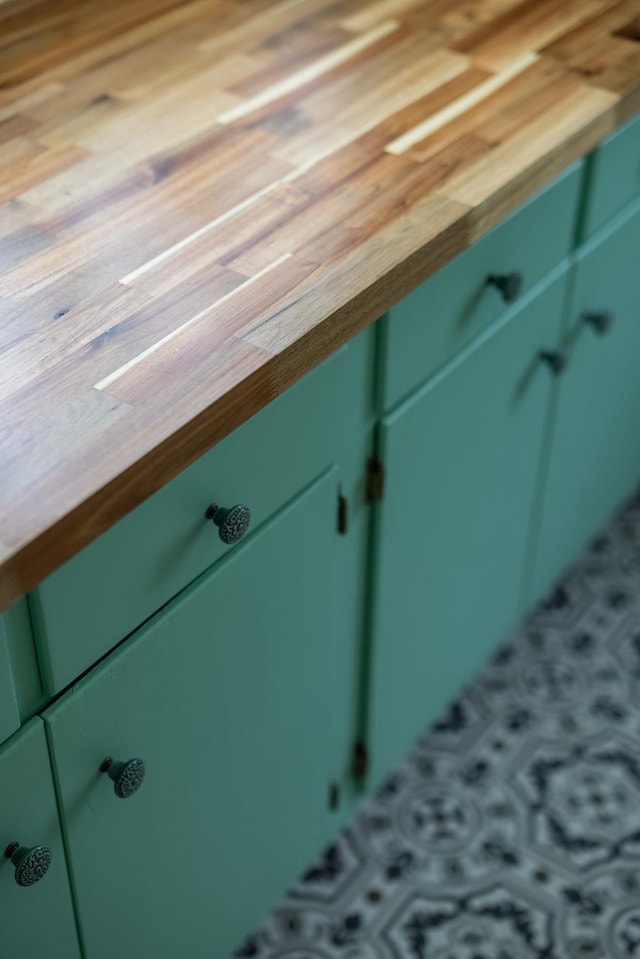 406 Madison Ave, Eatonton, GA 31024 - detailed view of butcher block countertops and green cabinetry