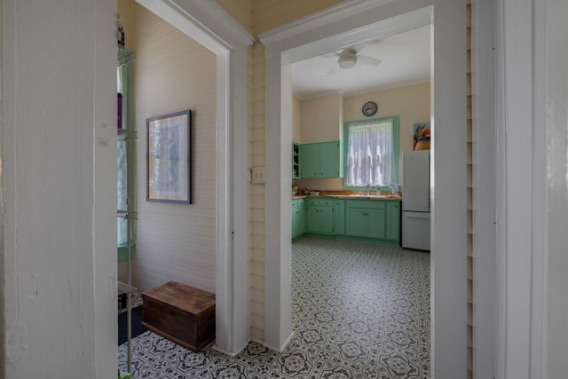 406 Madison Ave, Eatonton, GA 31024 - corridor with ornamental molding, light floors, and a sink