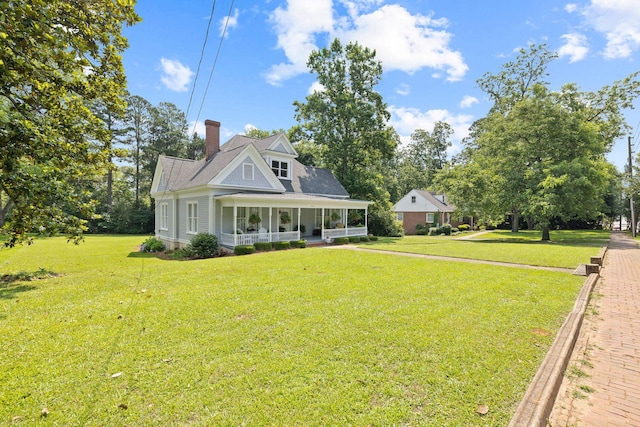 406 Madison Ave, Eatonton, GA 31024 - view of front of house with a front yard and a chimney