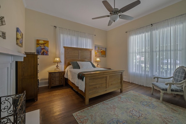 406 Madison Ave, Eatonton, GA 31024 - bedroom with wood finished floors, crown molding, baseboards, and a ceiling fan