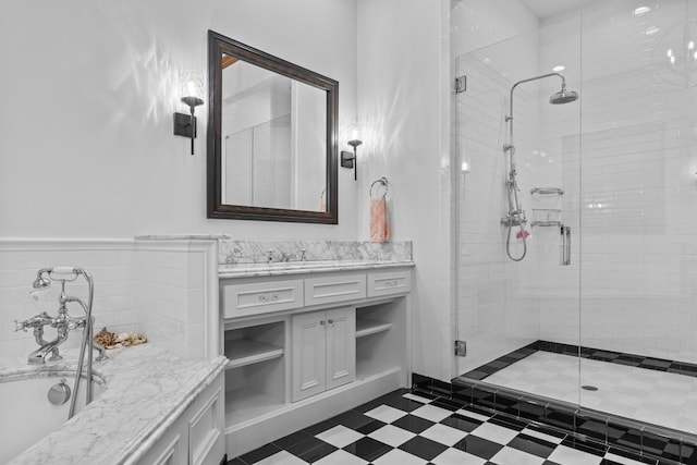 bathroom featuring vanity and a shower with shower door