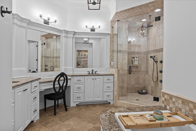 bathroom with crown molding, vanity, and walk in shower