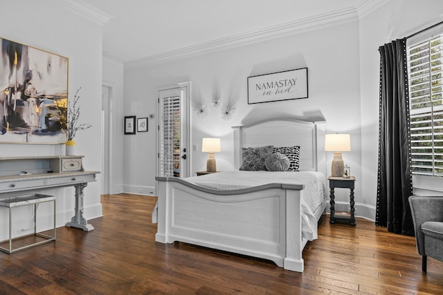 bedroom with crown molding, dark hardwood / wood-style floors, and access to exterior