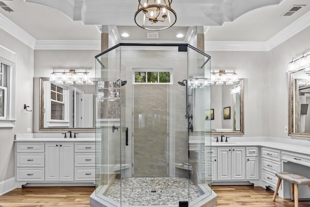 bathroom with vanity, wood-type flooring, and ornamental molding