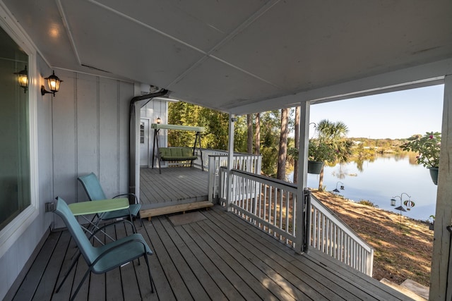 wooden deck featuring a water view