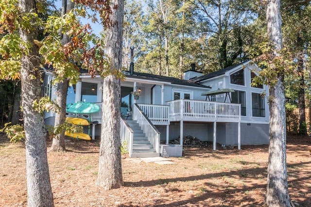 rear view of property with a deck