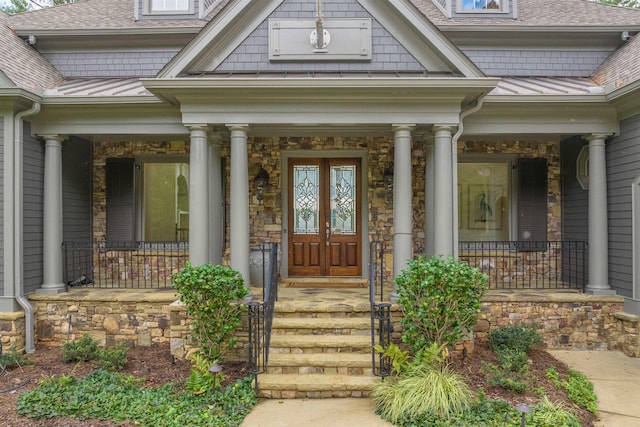 view of exterior entry featuring french doors