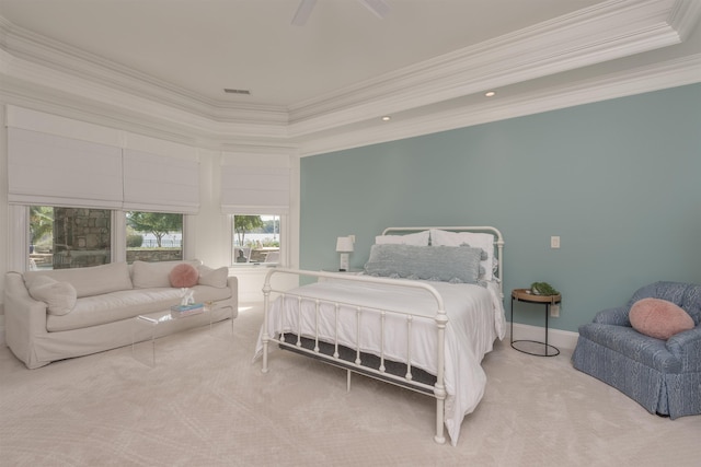 carpeted bedroom with ornamental molding and ceiling fan