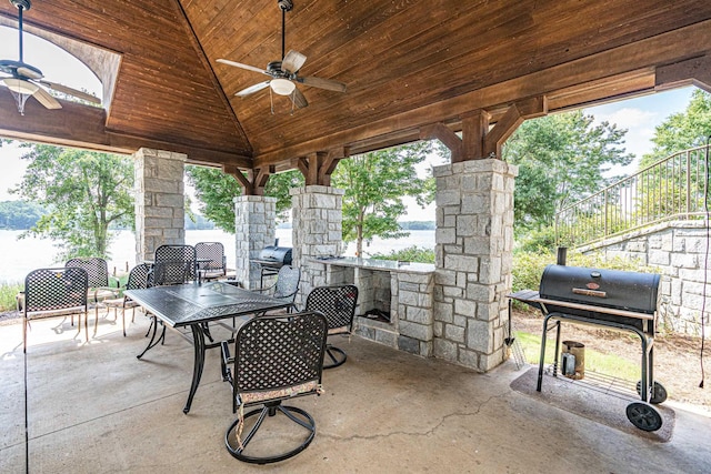 112-UNIT309 Indian Summer Path, Eatonton, GA 31024 - view of patio / terrace with ceiling fan, grilling area, outdoor dining space, and a water view