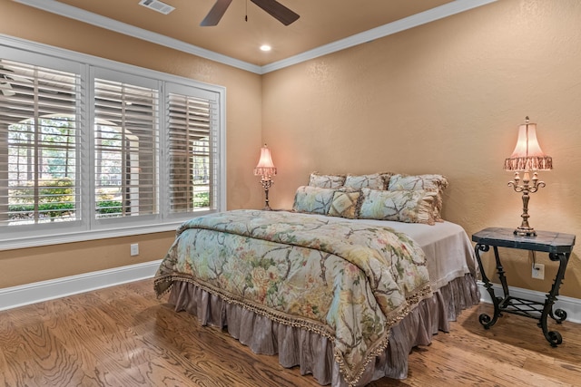 1031 Sugar Run, Greensboro, GA 30642 - bedroom with baseboards, crown molding, wood finished floors, a ceiling fan, and recessed lighting