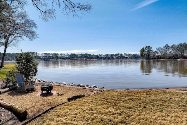 water view featuring an outdoor fire pit