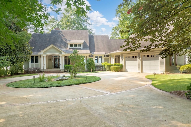 140 Winnstead Pl, Eatonton, GA 31024 - view of front facade with curved driveway, a garage, and a front lawn