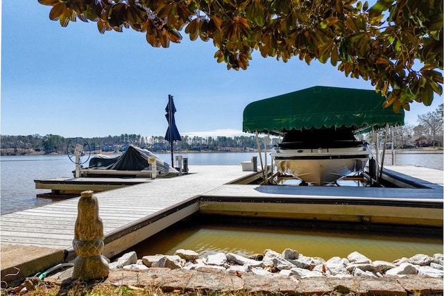 view of dock featuring a water view and boat lift