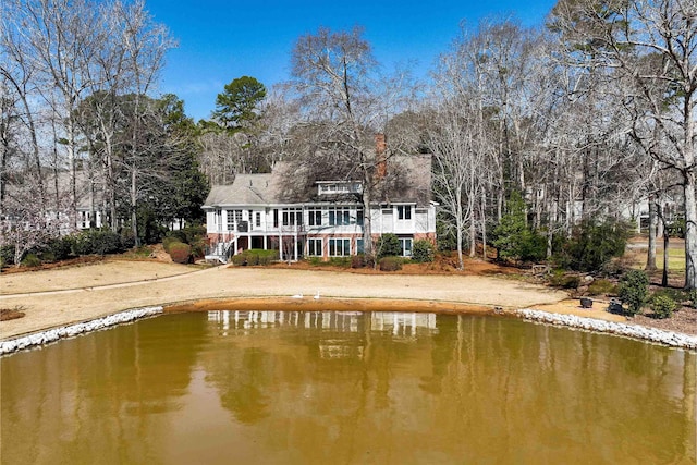 rear view of house with a water view