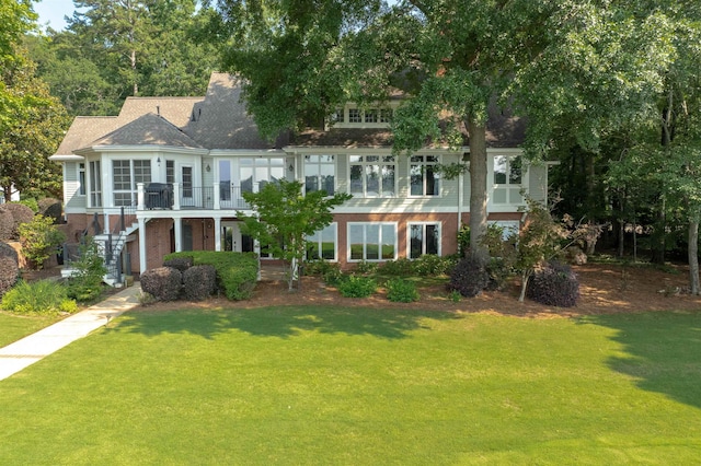 140 Winnstead Pl, Eatonton, GA 31024 - townhome / multi-family property with a front yard, stairway, brick siding, and a deck