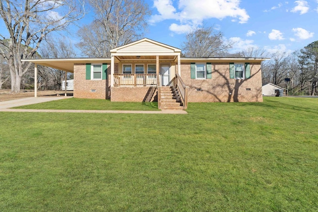 view of front of house with a front yard, a carport, and covered porch