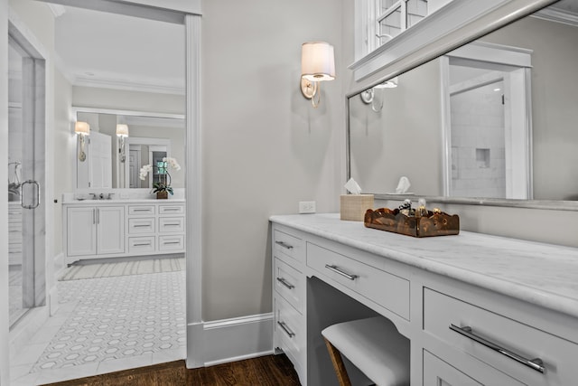 1140 Plantation Point Dr, Greensboro, GA 30642 - bathroom featuring vanity, baseboards, ornamental molding, and a stall shower