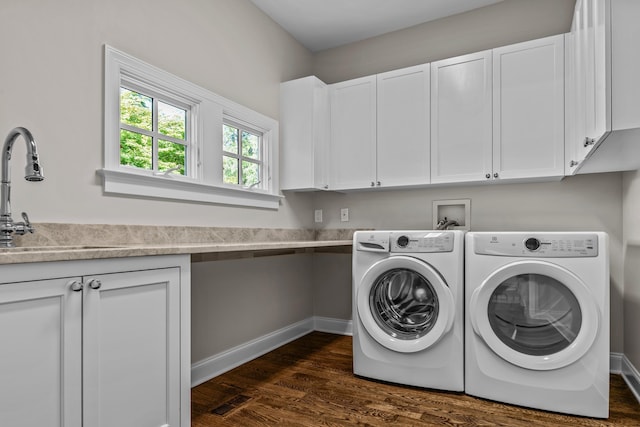 1140 Plantation Point Dr, Greensboro, GA 30642 - laundry room with a sink, dark wood finished floors, cabinet space, and washer and clothes dryer