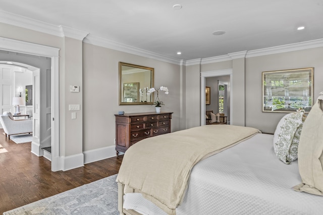 1140 Plantation Point Dr, Greensboro, GA 30642 - bedroom with crown molding, baseboards, dark wood-type flooring, recessed lighting, and arched walkways