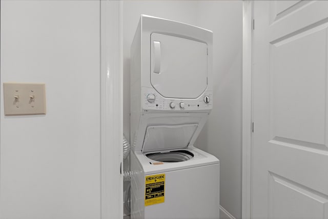 laundry area with stacked washer / dryer