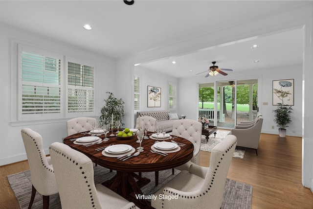 dining room featuring ceiling fan and hardwood / wood-style floors