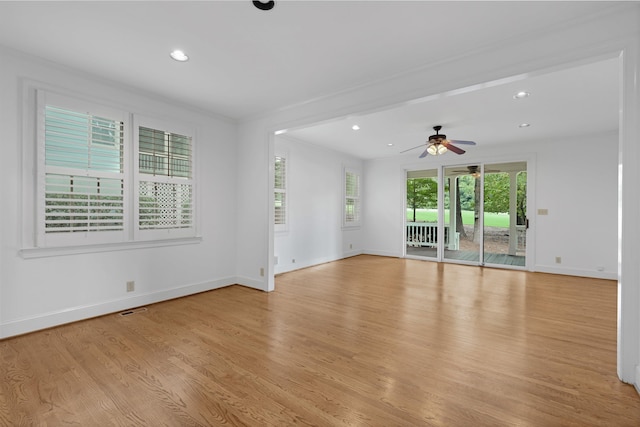 unfurnished room with ceiling fan and light hardwood / wood-style flooring